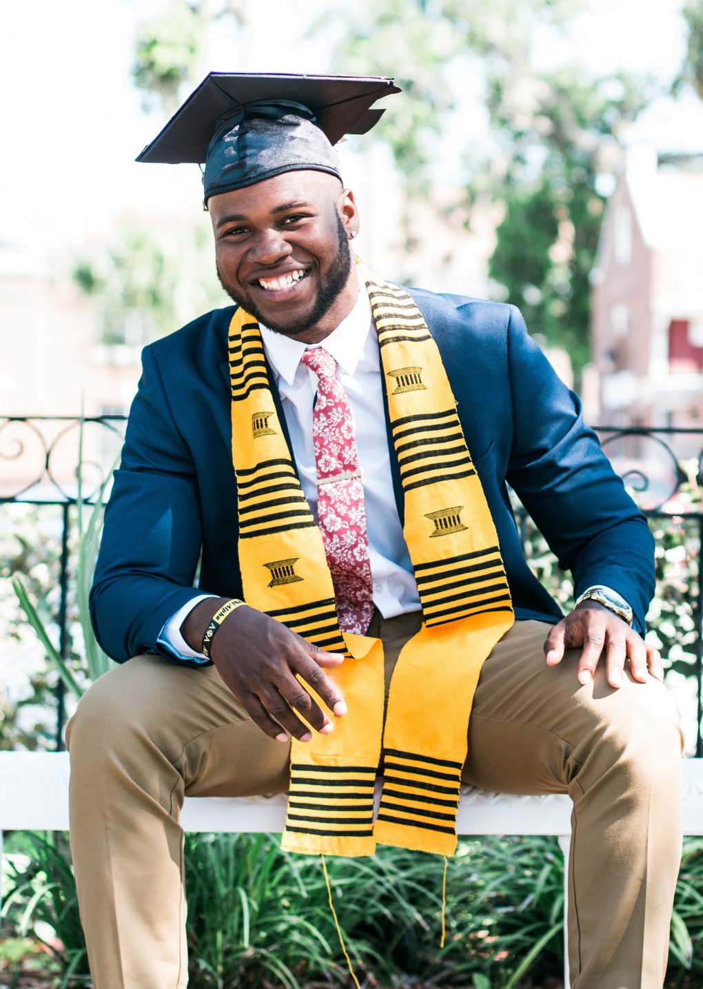 Male graduate smiling